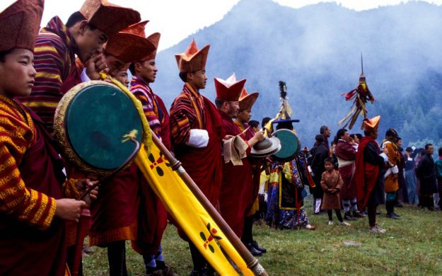 Bhutan festival performers with instruments